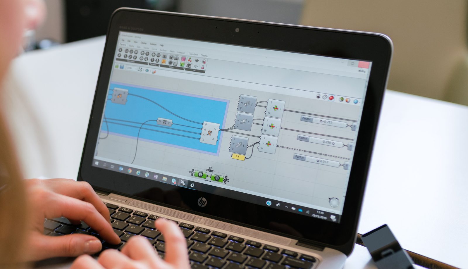 Person building an automated workflow on a laptop